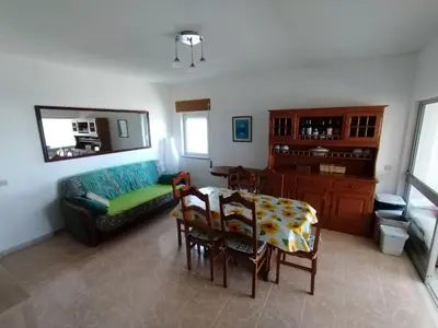 a living room with a table and a couch at Casa Francis in Aljezur