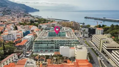 an aerial view of a city with a pink heart on a building at Cantinho do Atlântico in Funchal