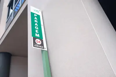 a green and white sign on the side of a building at Tulip Apartments Funchal by Mercado dos Lavradores com AC in Funchal