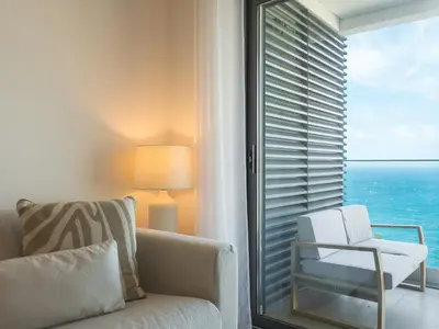 a living room with a couch and a view of the ocean at Glamorous Apartment by Atlantic Holiday in Funchal