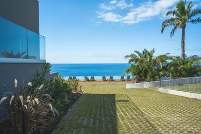 a view of the beach from a house at Glamorous Apartment by Atlantic Holiday in Funchal
