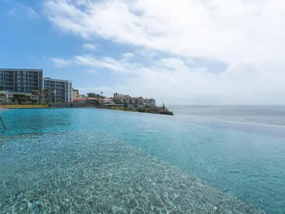 a swimming pool with a view of the ocean at Glamorous Apartment by Atlantic Holiday in Funchal