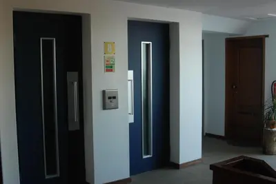 a hallway with three elevators in a room at Apartamento do Mar in Funchal
