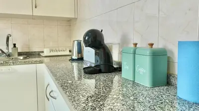 a kitchen counter with a juicer sitting on top of it at Green Haven in Funchal