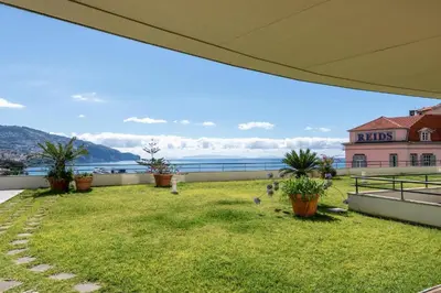 a balcony with a yard with potted plants at Suite 106 in Funchal