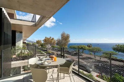 a view from the balcony of a house with a table and chairs at Savoy Monumentalis I by An Island Apart in Funchal