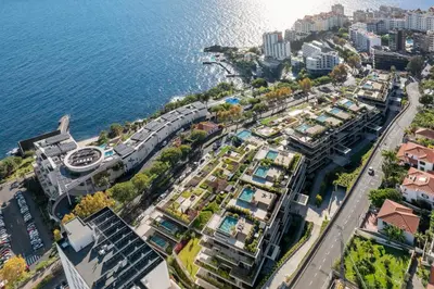 an aerial view of a city next to the water at Savoy Monumentalis I by An Island Apart in Funchal