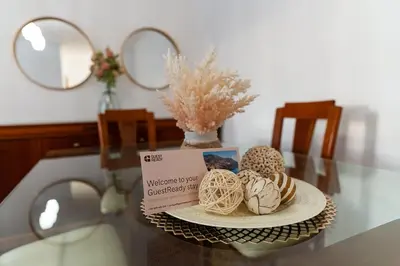 a glass table with a plate of pastries on it at GuestReady - Charming retreat in Funchal in Funchal