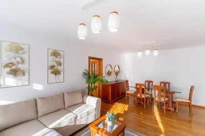 a living room with a couch and a dining room at GuestReady - Charming retreat in Funchal in Funchal