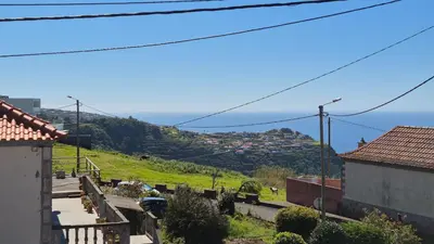 a door to a house with an orange roof at Apartamento Pestana in Arco da Calheta