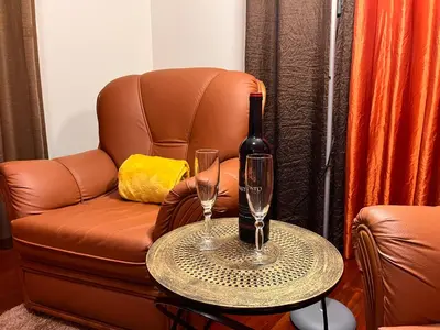 a living room with a gray couch and a table at Apartamento Pestana in Arco da Calheta