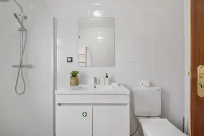 a white bathroom with a sink and a toilet at Horizon Glow II by Zest & Guest in Ponta do Pargo