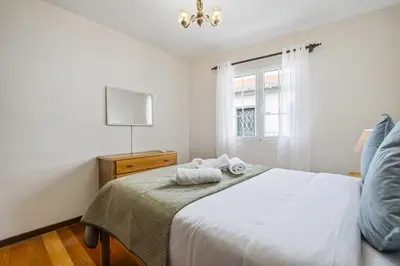 a bedroom with a bed with two towels on it at Horizon Glow II by Zest & Guest in Ponta do Pargo