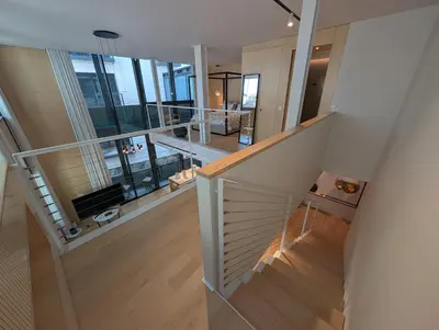 a staircase leading to the second floor of a house at Savoy Residence City Loft - Style and Sophistication in Funchal
