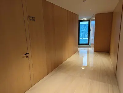 an empty hallway with a door and a window at Savoy Residence City Loft - Style and Sophistication in Funchal