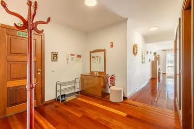 a living room with a dresser and a mirror at BoLina Ocean View in Caniço