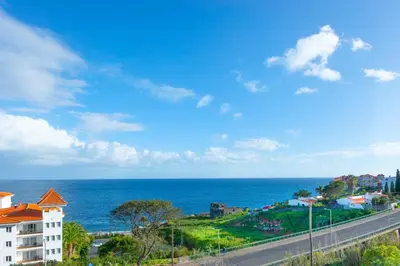a view of the ocean from a building at BoLina Ocean View in Caniço