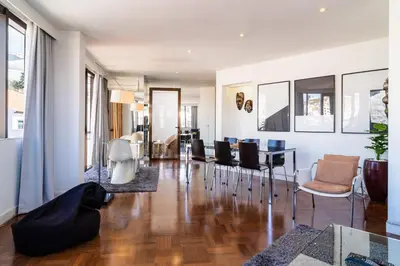 a living room with a table and chairs at GuestReady - Perfect home in the city centre in Funchal