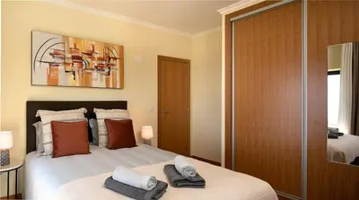 a bedroom with a bed with two towels on it at Casa Pimenta in Fajã da Ovelha in Prazeres
