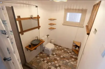 a small bathroom with a sink and a toilet at Boho Bispo Apartments in Vila do Bispo