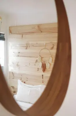 a mirror reflection of a bed in a bedroom at Boho Bispo Apartments in Vila do Bispo