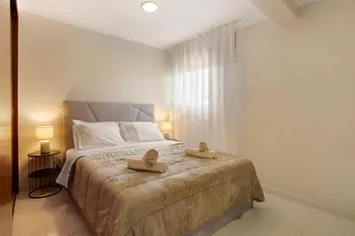 a bedroom with a bed with two hats on it at Madeira Funchal Stay in Funchal