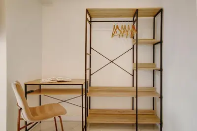 a closet with a desk and a chair at Madeira Funchal Stay in Funchal