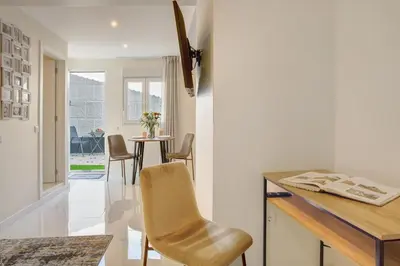 a kitchen and dining room with a table and chairs at Madeira Funchal Stay in Funchal