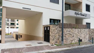 a building with a stone wall and a door at Brava Suite by LovelyStay in Ribeira Brava