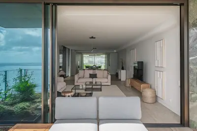 a living room with a view of the ocean at Savoy Monumentalis III by An Island Apart in Funchal
