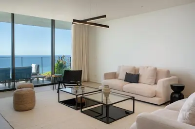 a living room with a couch and a table at Savoy Monumentalis III by An Island Apart in Funchal