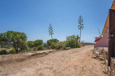 a dirt road in front of a house at Casa da Lua in Aljezur