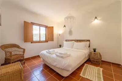 a bedroom with a bed with towels on it at Villa Azure Family & Surf Escape in Aljezur
