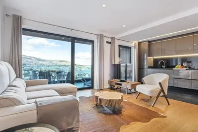 a living room with a couch and a table at Apartment Bay View - By WeHost in Funchal