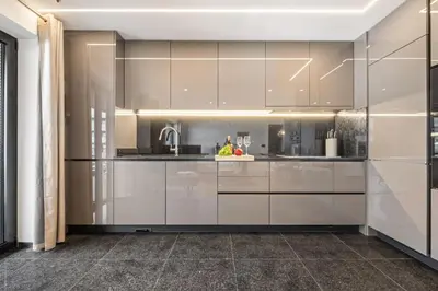 a kitchen with white cabinets and a sink at Apartment Bay View - By WeHost in Funchal