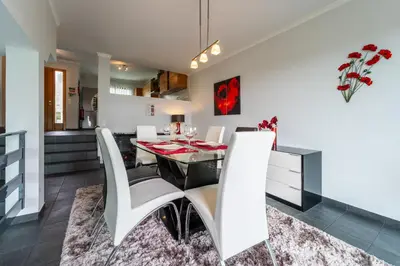 a dining room with a table and chairs at Rosa Villa Porto Santo by YOUR KEY in Porto Santo