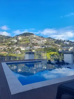 a swimming pool on the roof of a building at Art House Madeira I in Caniço