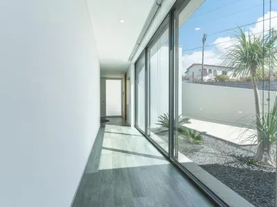 a hallway of a house with sliding glass doors at Villa Primavera by Atlantic Holiday in Calheta
