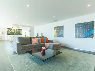 a living room with a couch and a table at Villa Primavera by Atlantic Holiday in Calheta