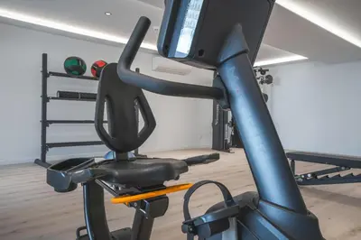 a gym room with a exercise bike with a treadmill at Acqua The Finnest by Atlantic Holiday in Funchal