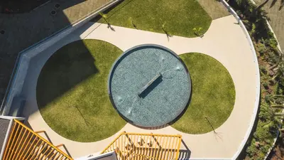 an overhead view of a clock in the grass at Acqua The Finnest by Atlantic Holiday in Funchal