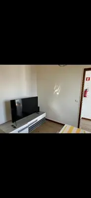 a living room with a flat screen tv on a wall at House Dino & Telma in Machico