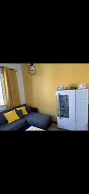a living room with a couch and a tv at House Dino & Telma in Machico