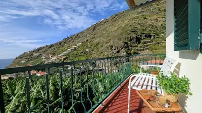 a balcony with a view of a mountain at Banana Lovers - Farm View in Ribeira Brava