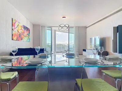 a dining room with a glass table and chairs at MPR The Finnest by Atlantic Holiday in Funchal