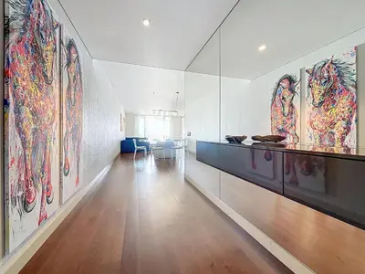 a hallway with paintings on the walls of a building at MPR The Finnest by Atlantic Holiday in Funchal