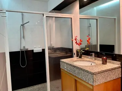 a bathroom with a shower and a sink and a shower at Funchal Center Apartment in Funchal