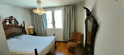 a dining room with a table and chairs at Lido ocean front penthouse in Funchal