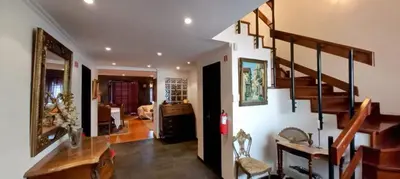 a dining room with a table and chairs at Lido ocean front penthouse in Funchal