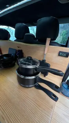a pot and pans sitting on the door of a car at Geko camper in Funchal